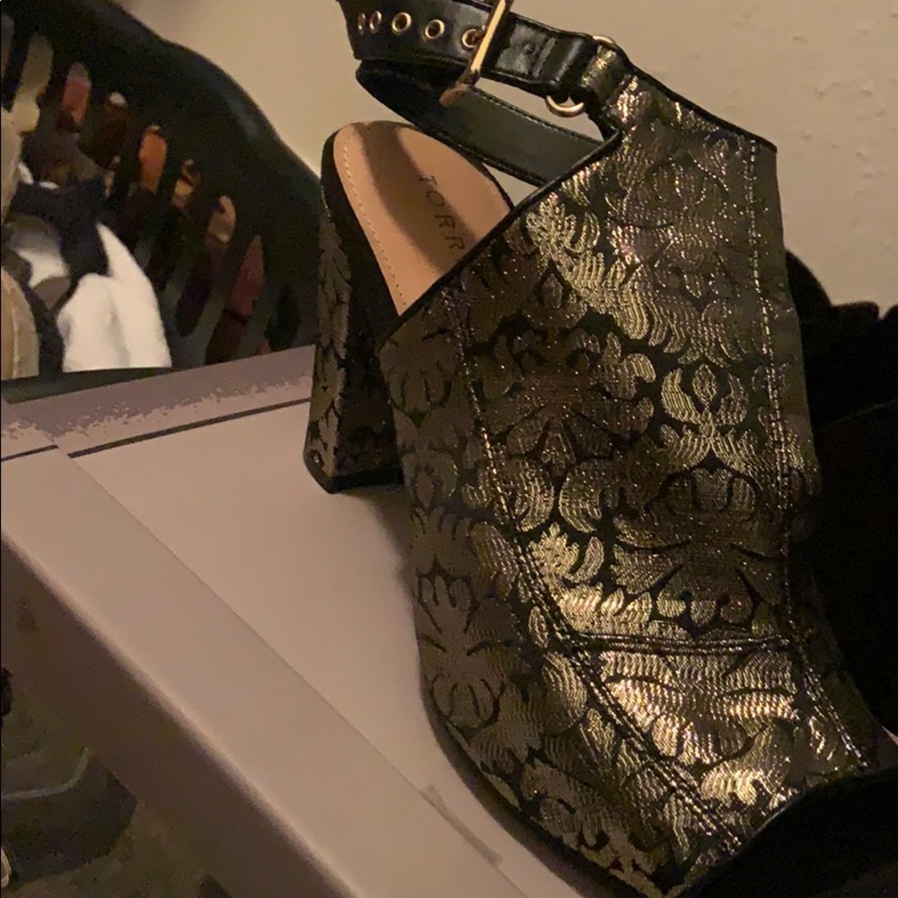 Gold and black heels